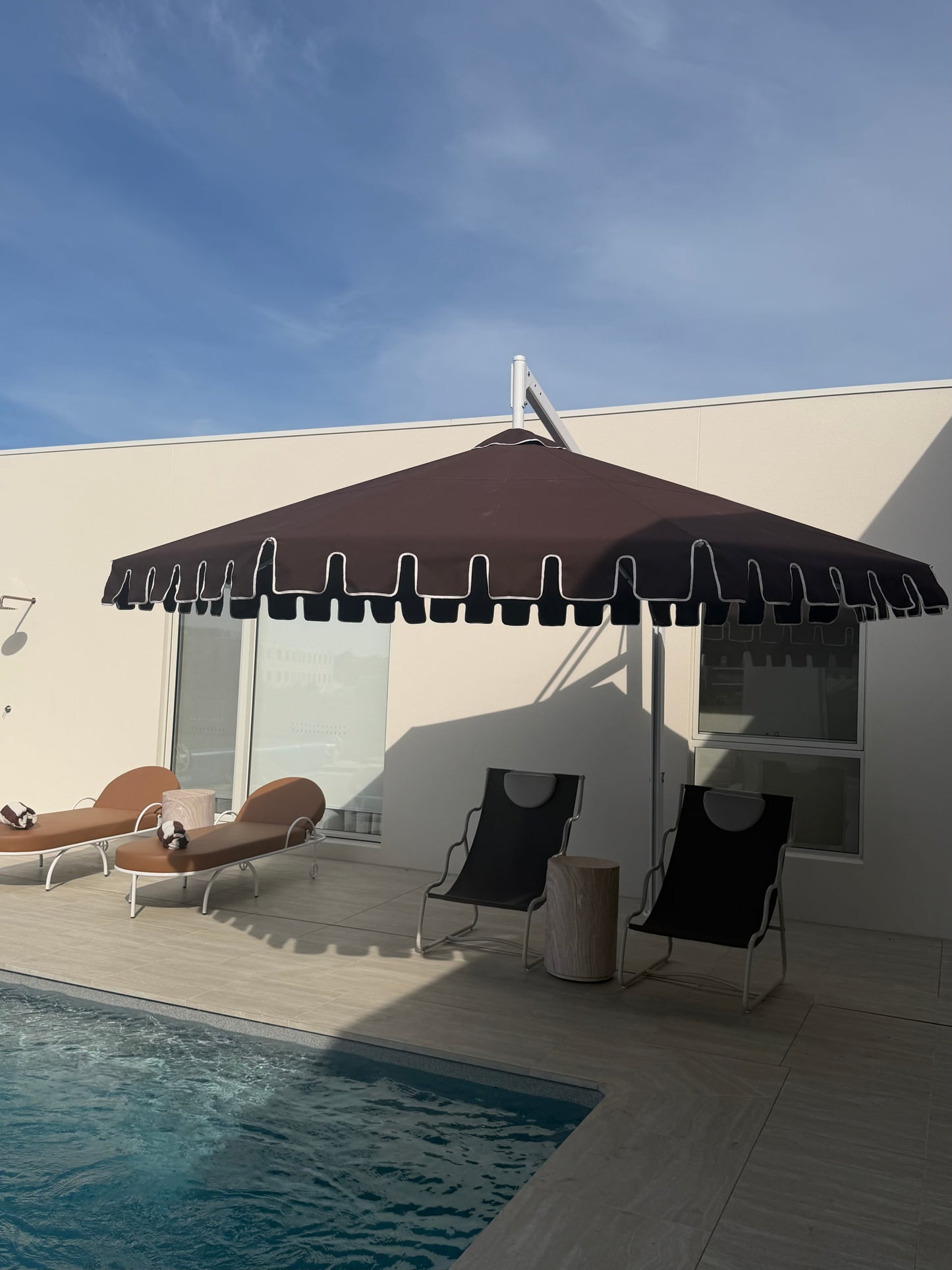 chocolate brown umbrella by a pool with classy chocolate brown furniture